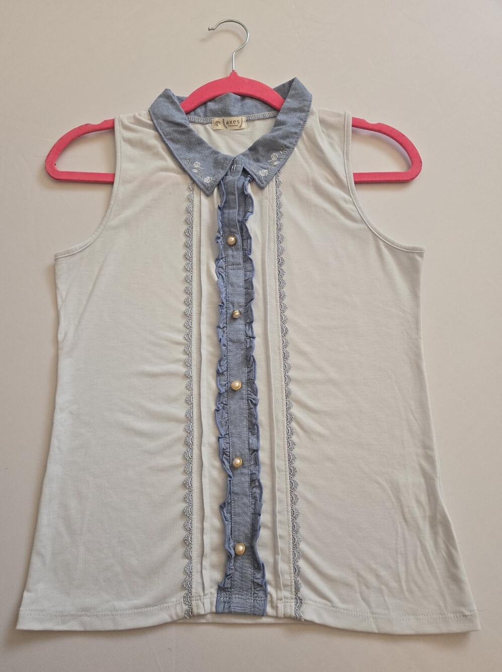 Sleeveless Babyblue Top with Ruffle Trim